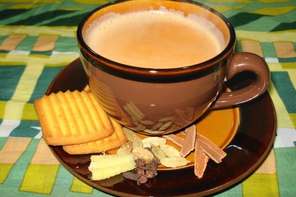 Milky chai tea in retro tea cup