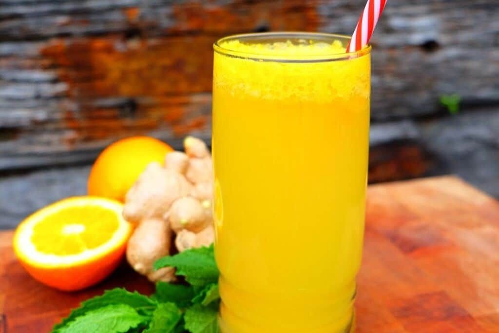 orange drink in tall glass