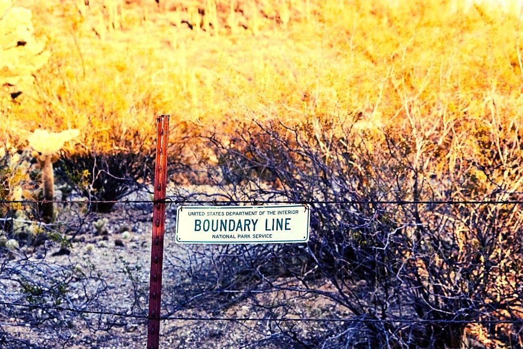 fence with boundary sign