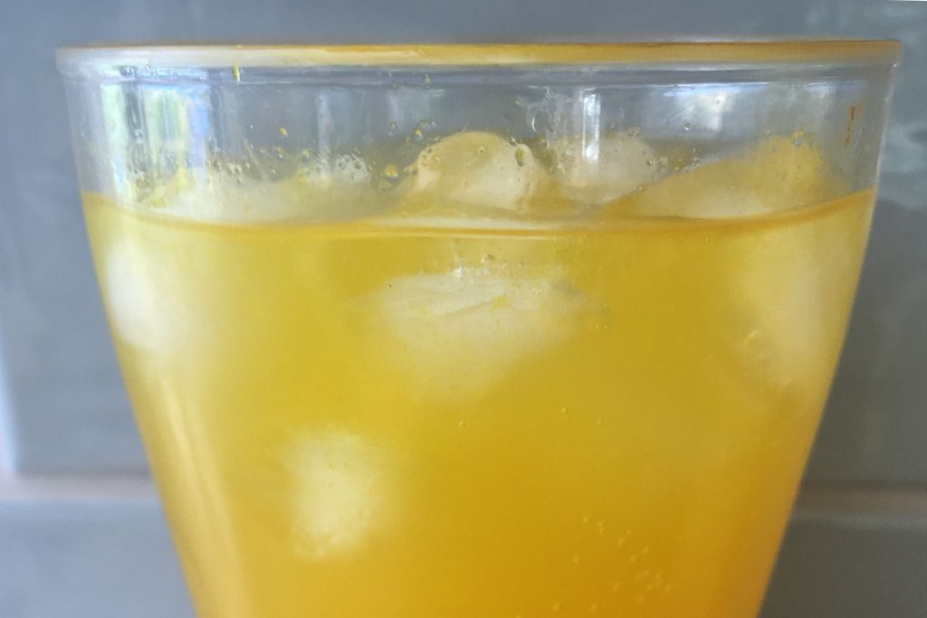 golden drink with ice